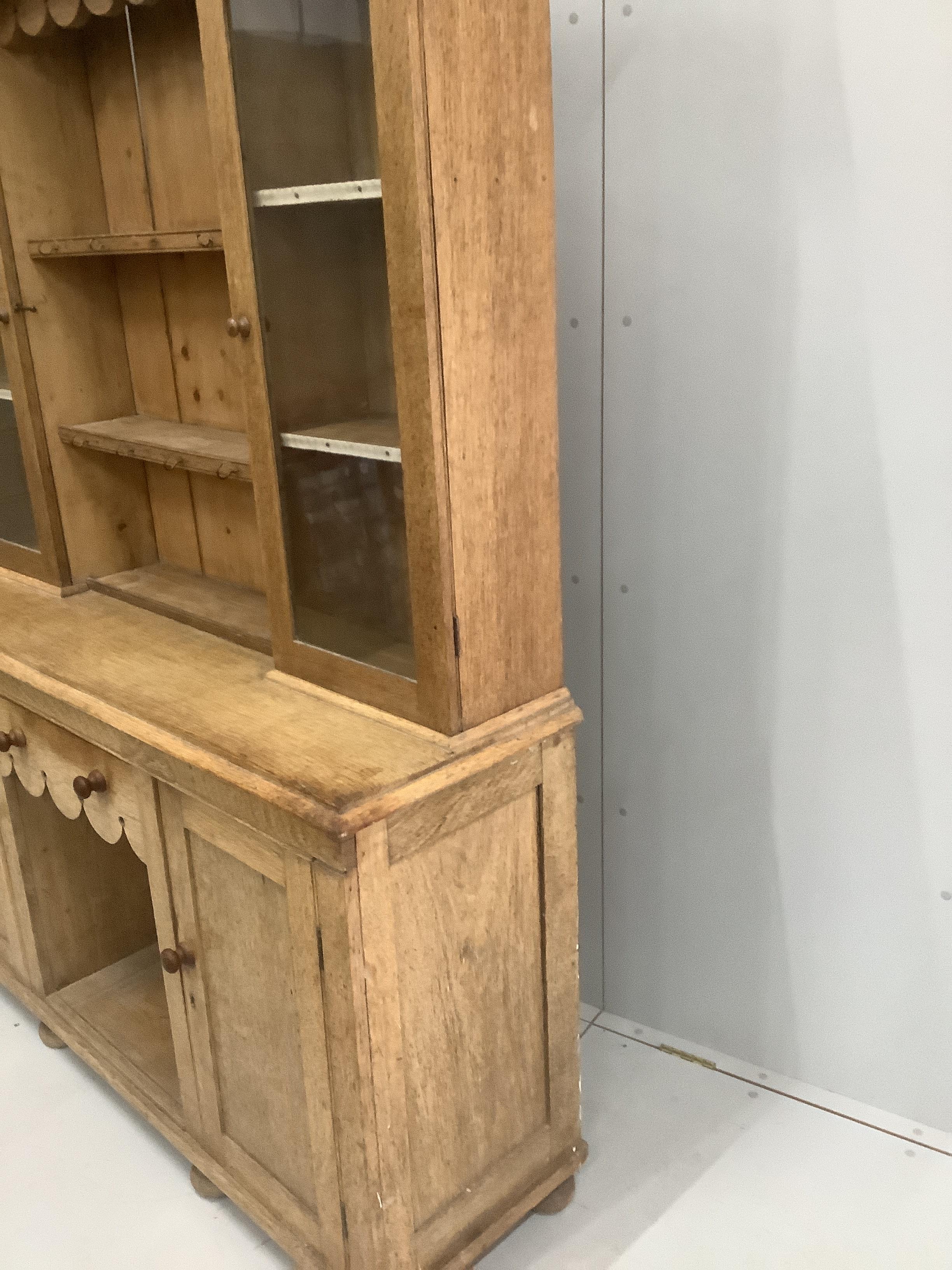 A late Victorian pale oak dresser, width 151cm, depth 44cm, height 202cm